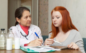 nurse and woman talking